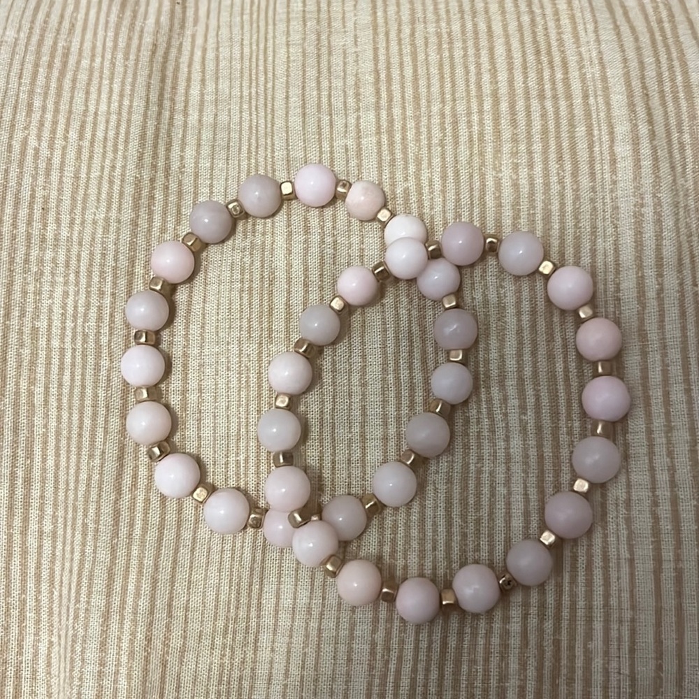Pink and gold bracelets